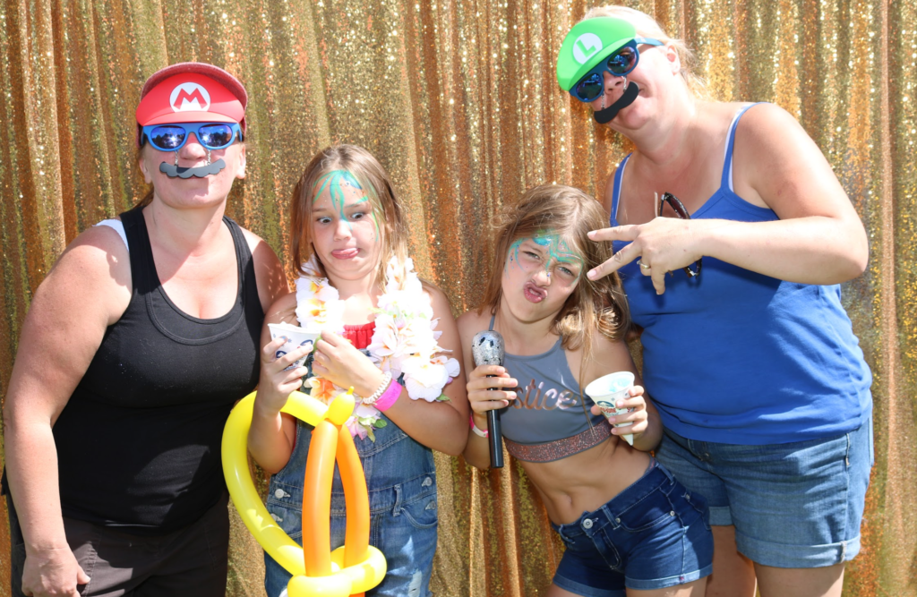 Toronto Photo booth family, with gold back drop and props 